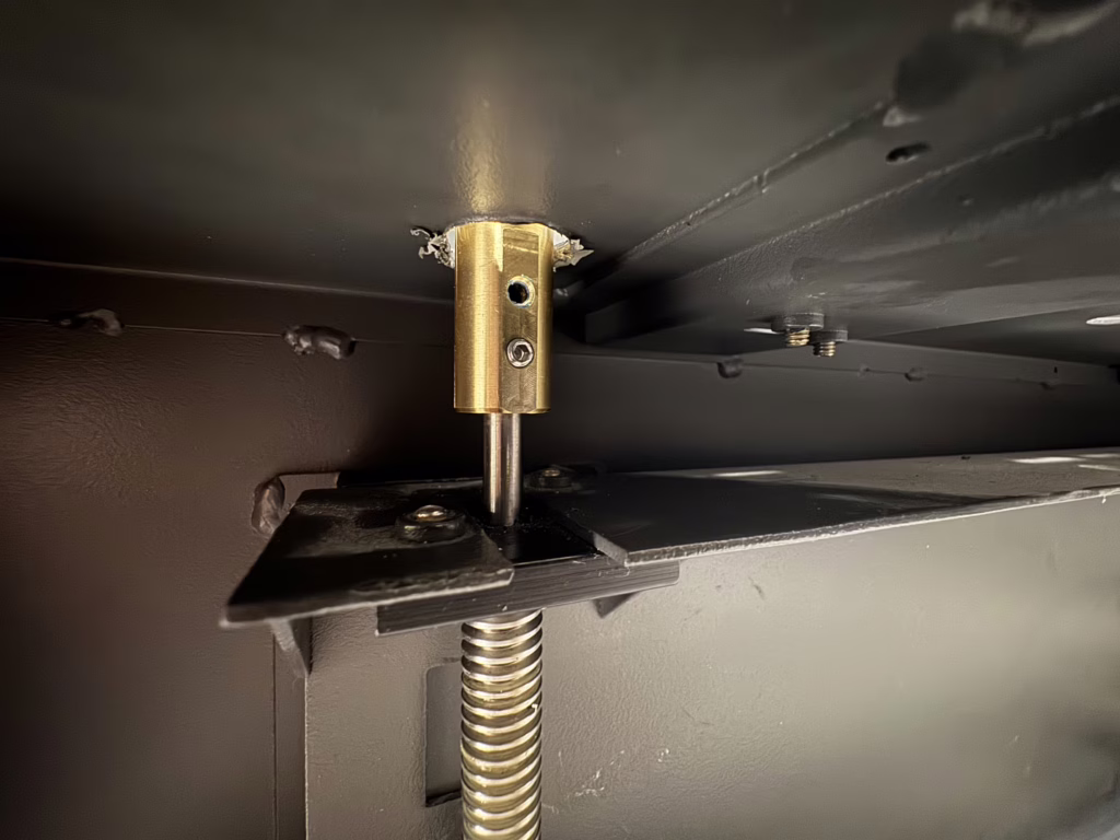 Manual override adapter installed in laser cutter frame